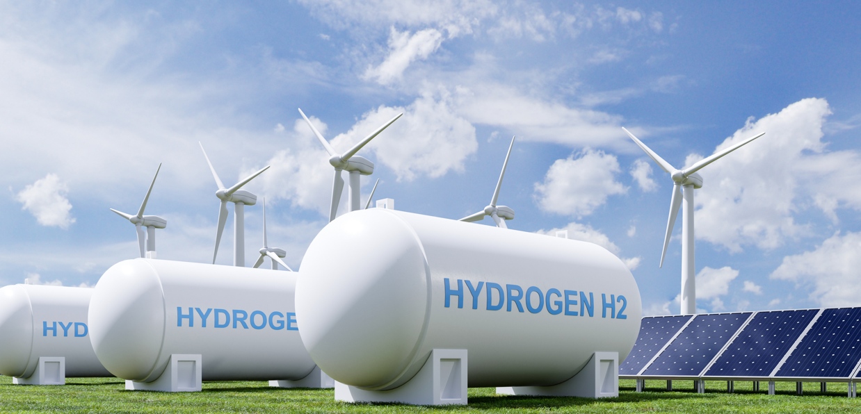 Wasserstoff-Tank, Solarzellen und Windräder als symbolbild für grünen Wasserstoff
