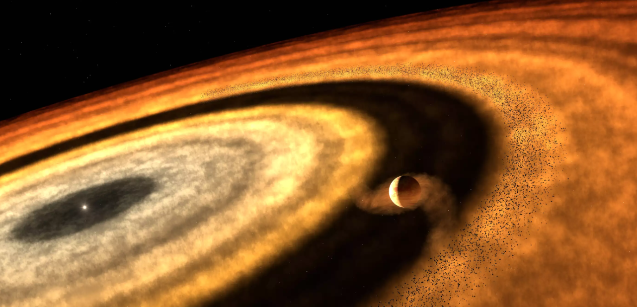 Wie Planeten entstehen Künstlerische Darstellung einer planetenbildenden Scheibe deutet eine ringförmige Struktur aus Gas und Staub an