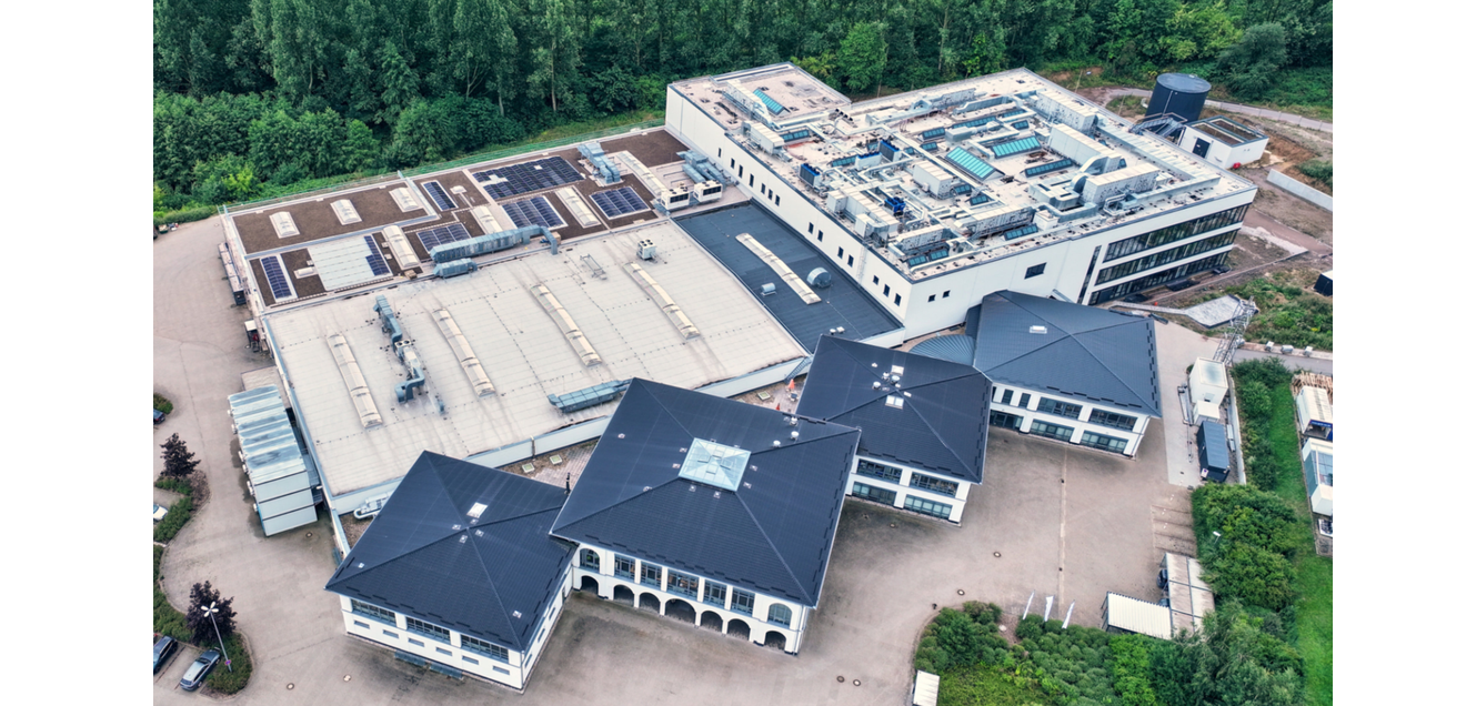 The new Endress und Hauser development and production building (top right) towers above the existing production halls.