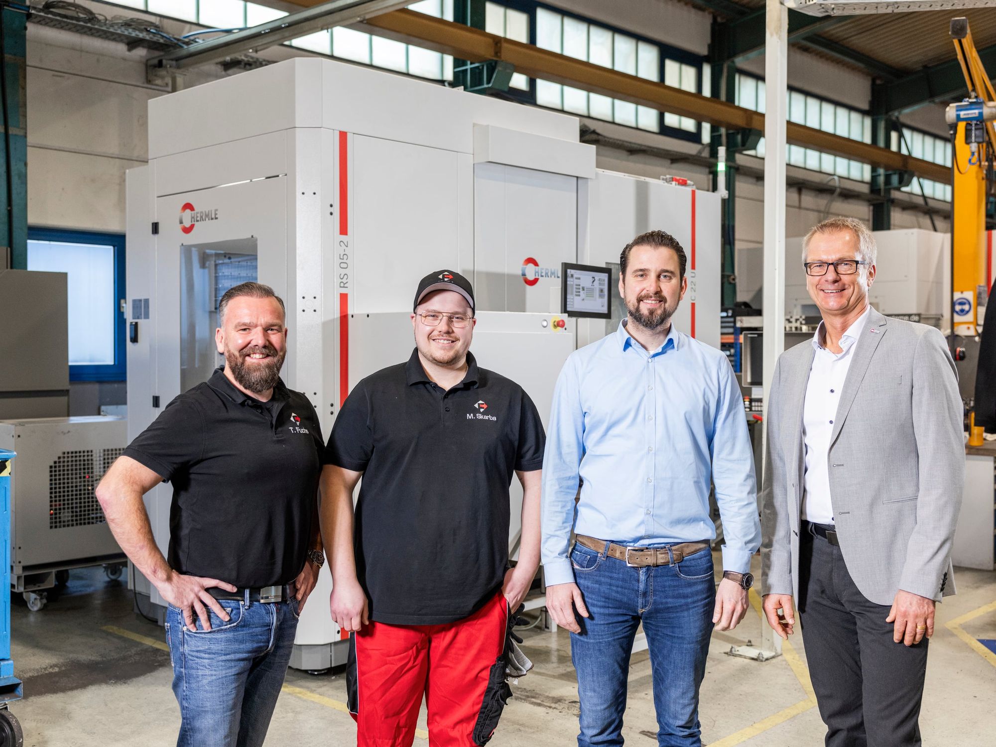 The FWM team Managing Director of FWM Thomas Fuchs, Deputy Head of the CNC Milling Department Maximilian Skarba and Managing Director Johannes Voit, together with Andreas Glumpler, Hermle Sales Field Service (from left)