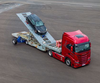 Truck with secured car as load Truck with secured car as load