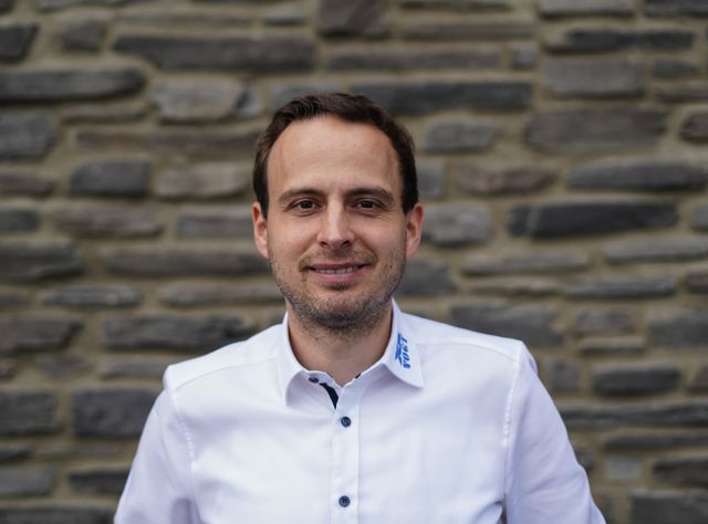 Andre Vogt lächelt freundlich in die Kamera