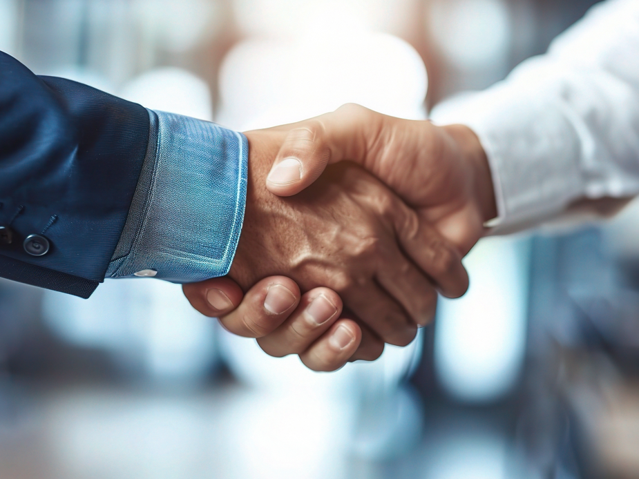 Handschlag zweier Geschäftspartner Handschlag zweier Geschäftspartner