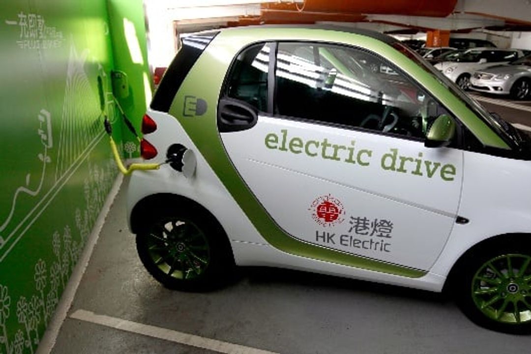 A Mercedes-Benz Smart Fortwo electric car refueling at a public charging station in Hong Kong. A Mercedes-Benz Smart Fortwo electric car refueling at a public charging station in Hong Kong.