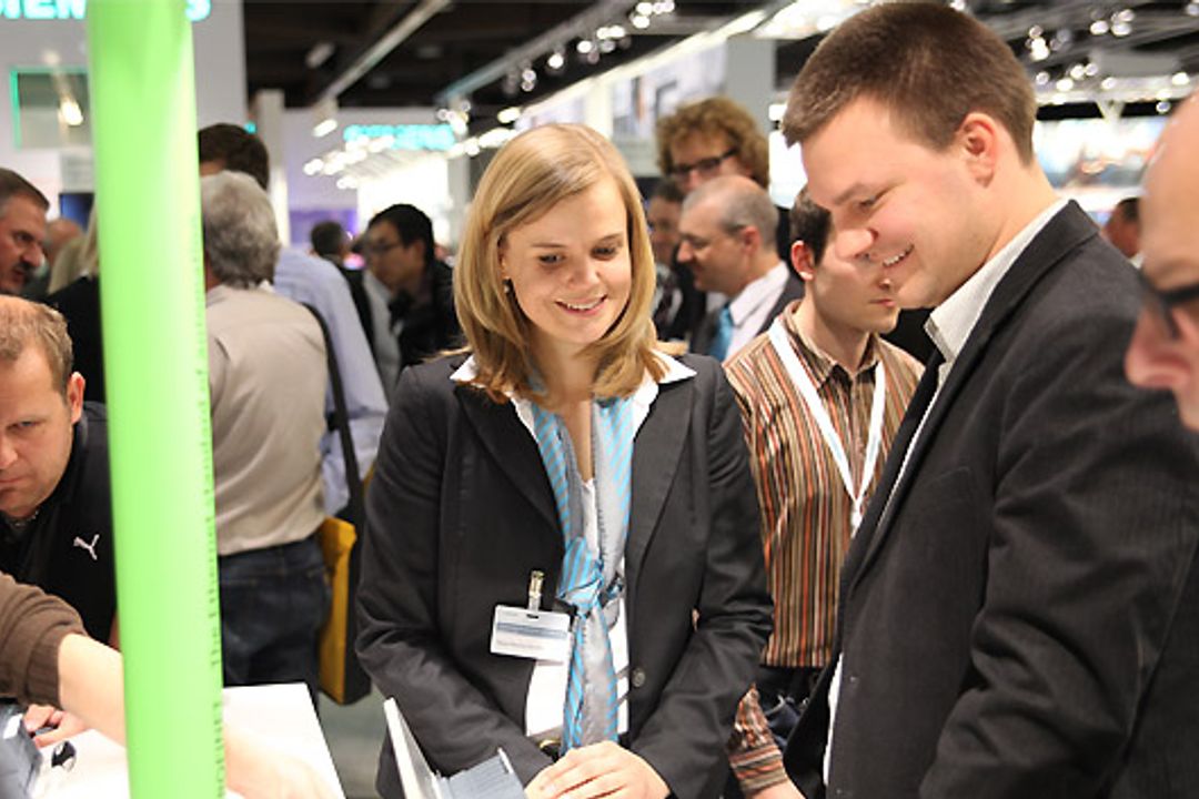 Teaser 2 Menschen auf der SPS IPC Drives 2012 in Nürnberg, Mesago