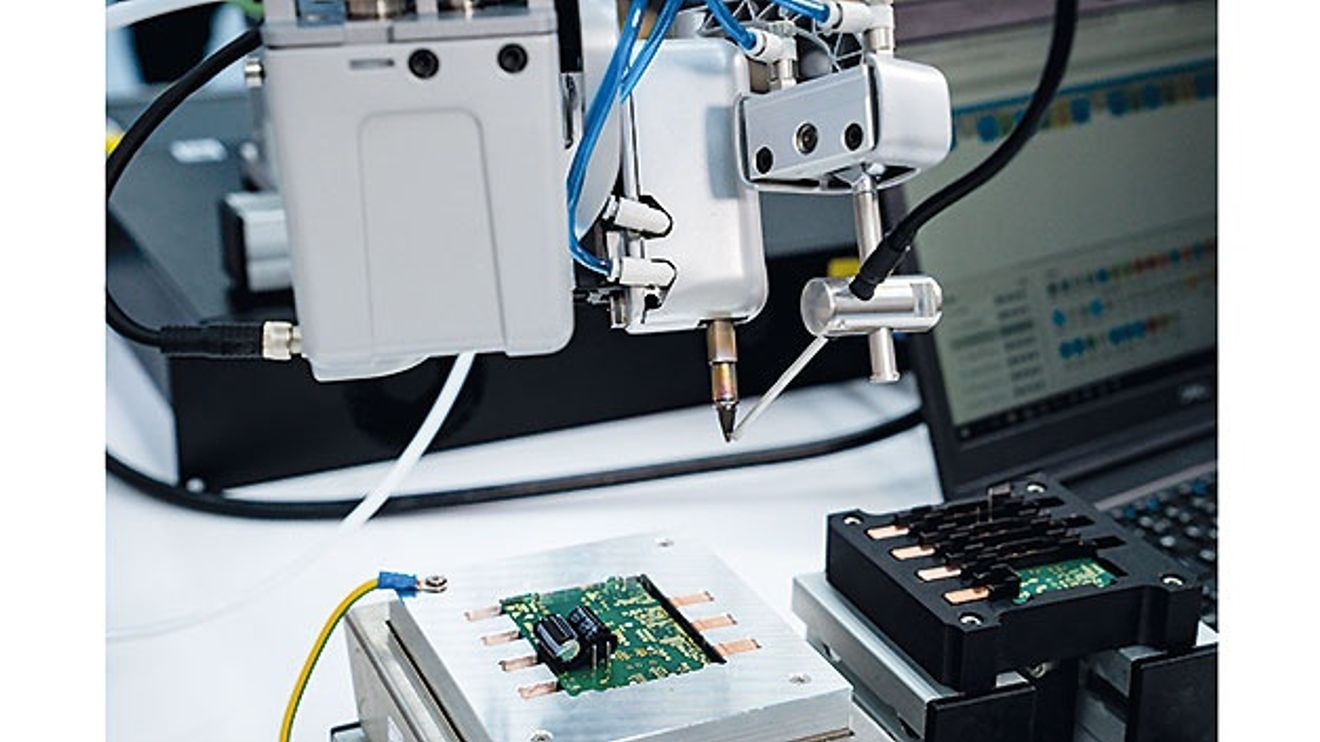 Cobots automate electronics function tests Cobots automate electronics function tests