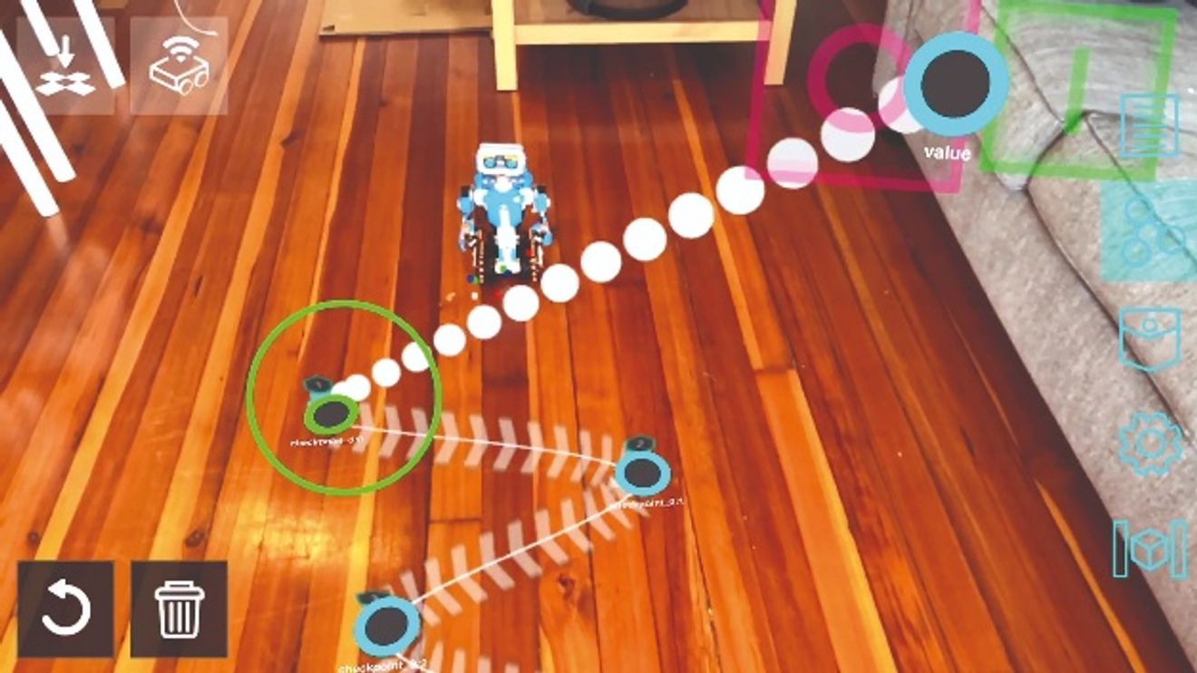 Bild 1. Vereinfachtes Teach-In bei der Programmierung eines Roboters über Handlungsanweisungen im physischen Aktionsraum. Bild 1. Vereinfachtes Teach-In bei der Programmierung eines Roboters über Handlungsanweisungen im physischen Aktionsraum.