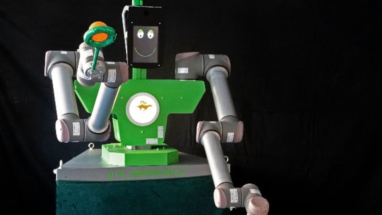 A "pi4_workerbot" holds juggling balls in the air. A "pi4_workerbot" holds juggling balls in the air.