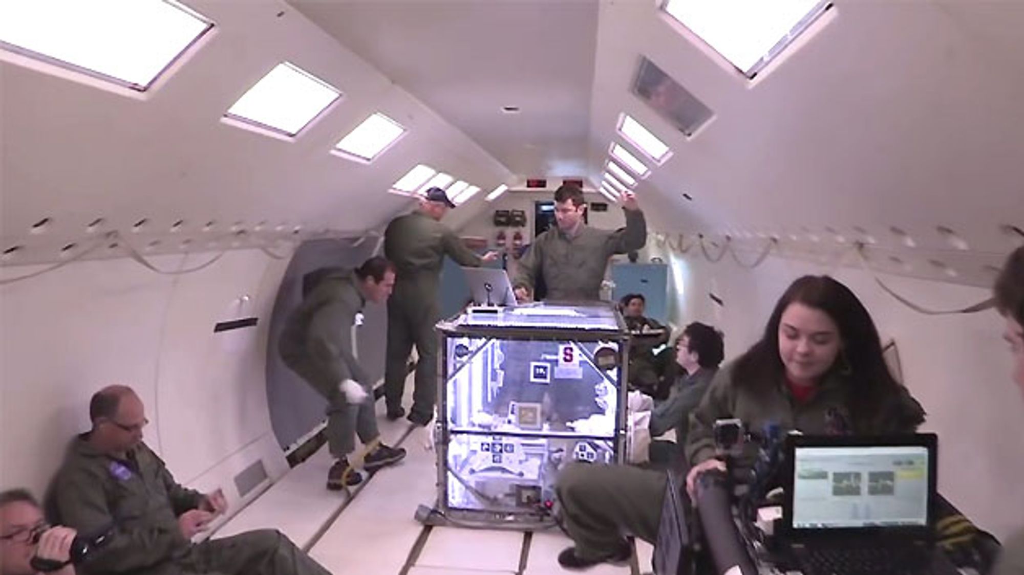 4 NASA engineers testing the Hedgehog bot in the C-9 aircraft 4 NASA engineers testing the Hedgehog bot in the C-9 aircraft
