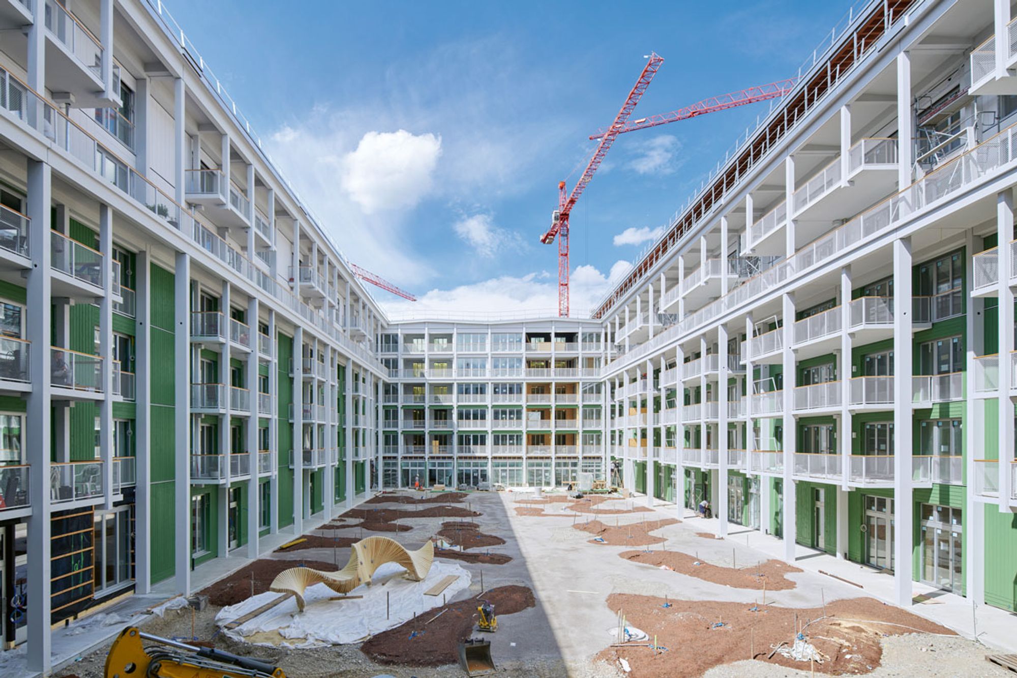 Der ringförmig angelegte 
Holzbau 
mit Innenhof 
beherbergt 
248 Genossenschafts-,Miet und Eigentumswohnungen (Foto: Gesewo - Zimmermannfotografie)