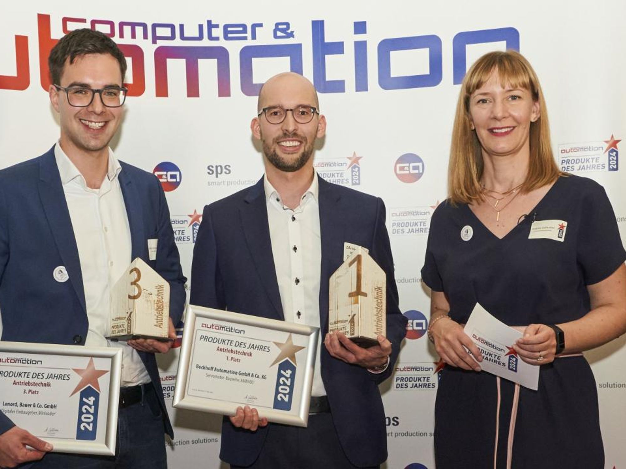 The winners of the 'Drive Technology' category Stefan Schneider (Lenord+Bauer) and Christopher Kleinert (Beckhoff) with Andrea Gillhuber (Computer&amp;Automation).