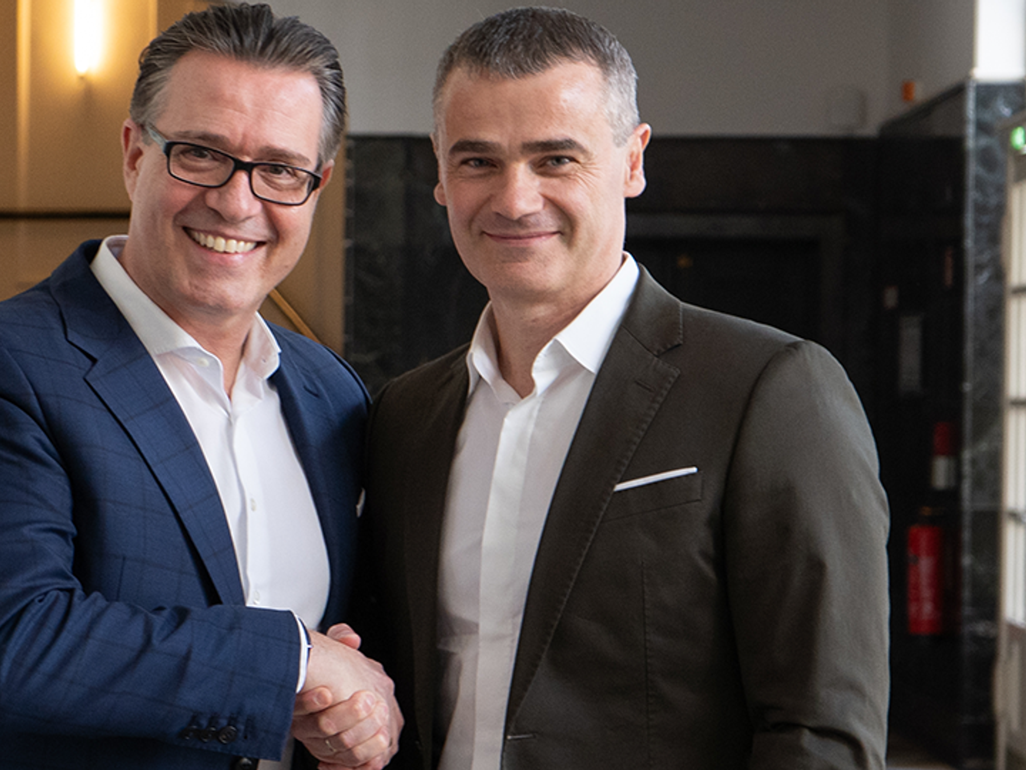 The outgoing CEO of Axians Germany, Jacques Diaz (left), with Burim Mirakaj, CEO Axians DACH &amp; CEE (Central Eastern Europe).