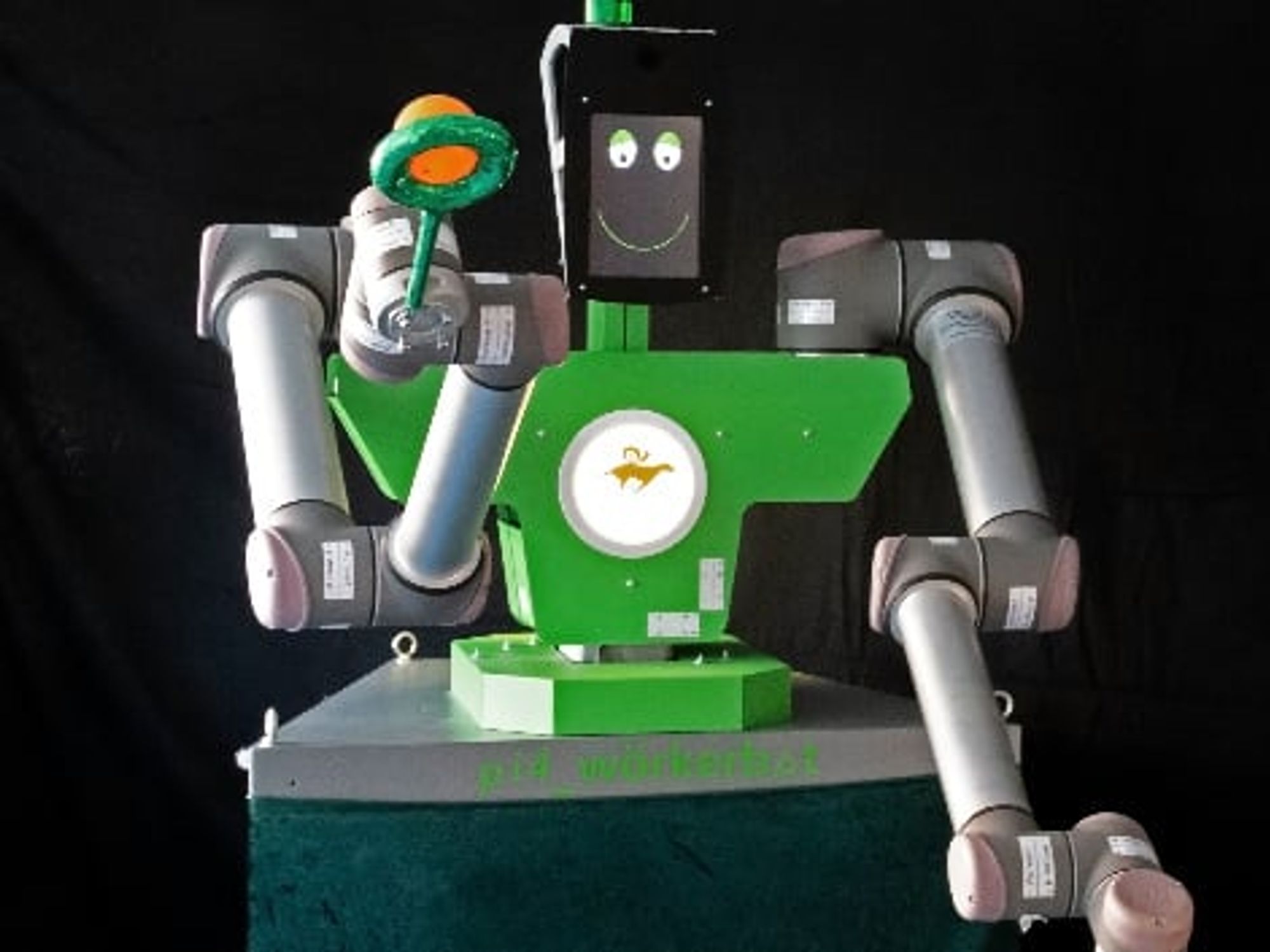 A "pi4_workerbot" holds juggling balls in the air.