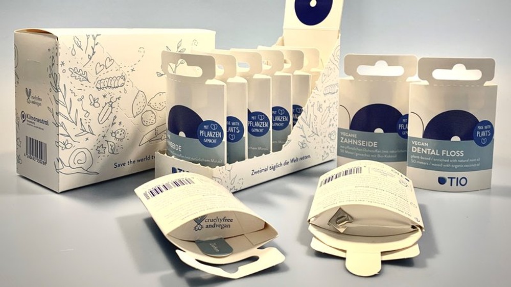 Cardboard dispenser box for dental floss Cardboard dispenser box for dental floss