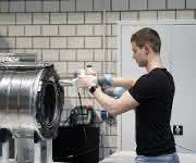 Washing machine assembly at Miele