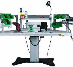 Electrically height-adjustable soldering table