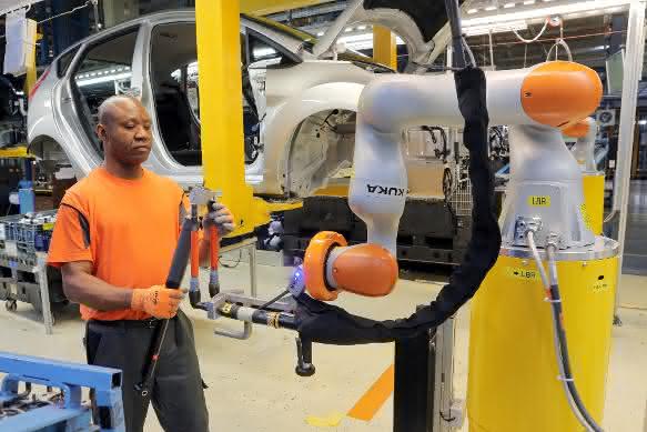 Ford Stoßdaempfer-Uebergabe an Roboter Ford Stoßdaempfer-Uebergabe an Roboter