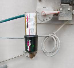 Simalube Impulse im Einsatz mit einem 125 ml Spender