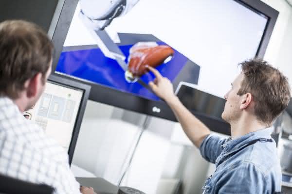 Verarbeitungsprozesse optimieren: 6-Achs-Roboter verarbeitet Fisch Verarbeitungsprozesse optimieren: 6-Achs-Roboter verarbeitet Fisch