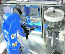 Among other things, the robot inserts small parts into the valve