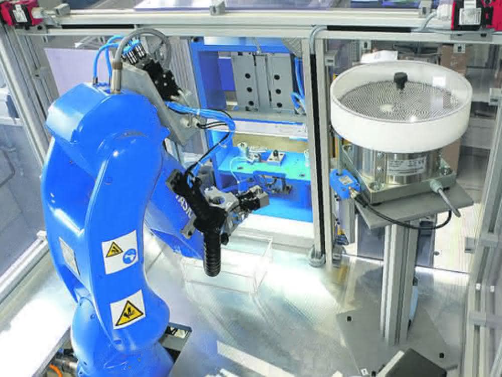 Among other things, the robot inserts small parts into the valve