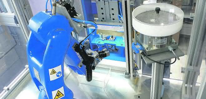 Among other things, the robot inserts small parts into the valve