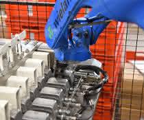 Automation of a machining center: Robot brings connector housing