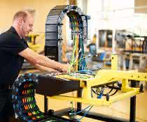 QL production Cable assembly: Cable carriers delivered to the line ready for installation