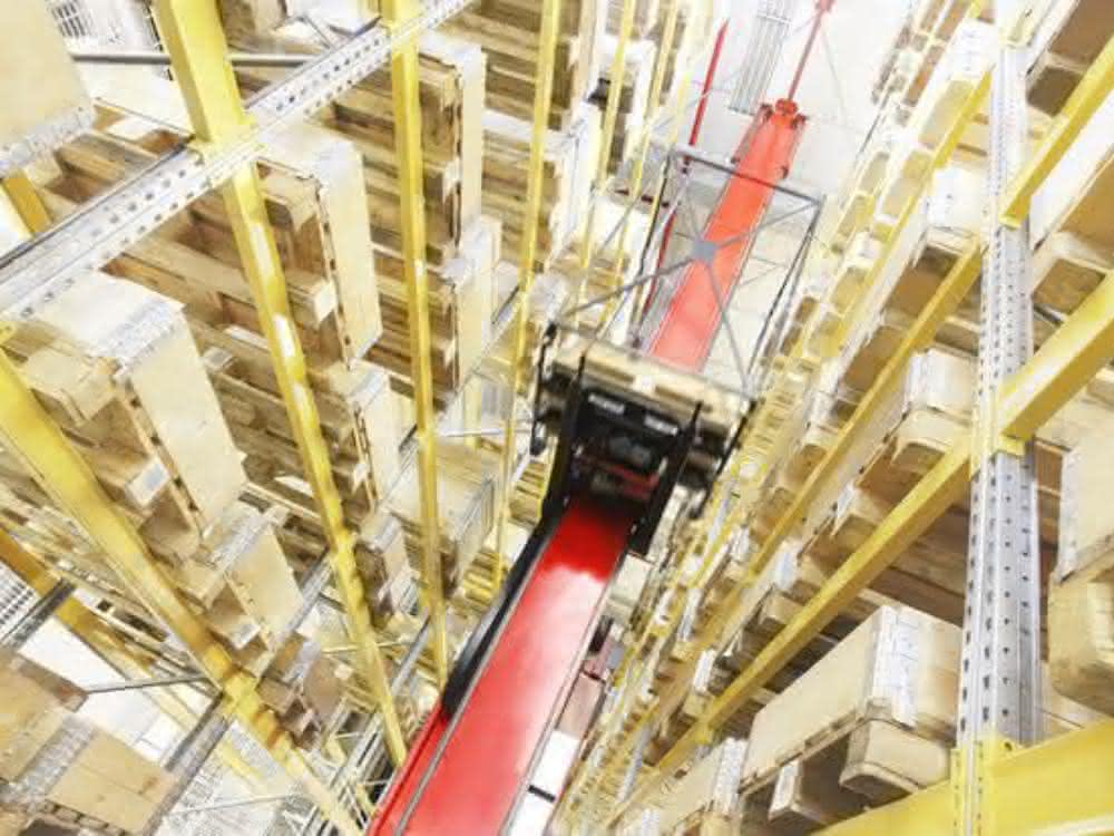 Rack conveyors in high-bay warehouses