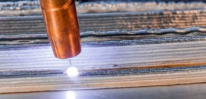 Arc and wire-based additive manufacturing