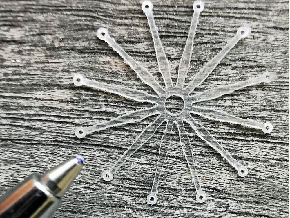 Component cut with a water jet from a 0.2 mm thick plastic film Component made of plastic film
