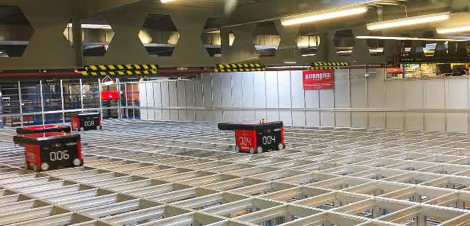 Ten high-speed robots move above the grid.