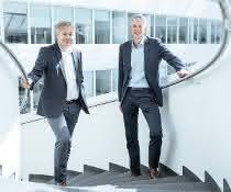 Frank Strecker (T-Systems) and Michael Otto (Kuka Robotics)