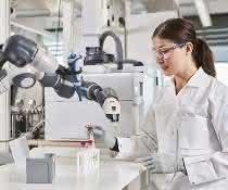 Robot arm and person in lab coat