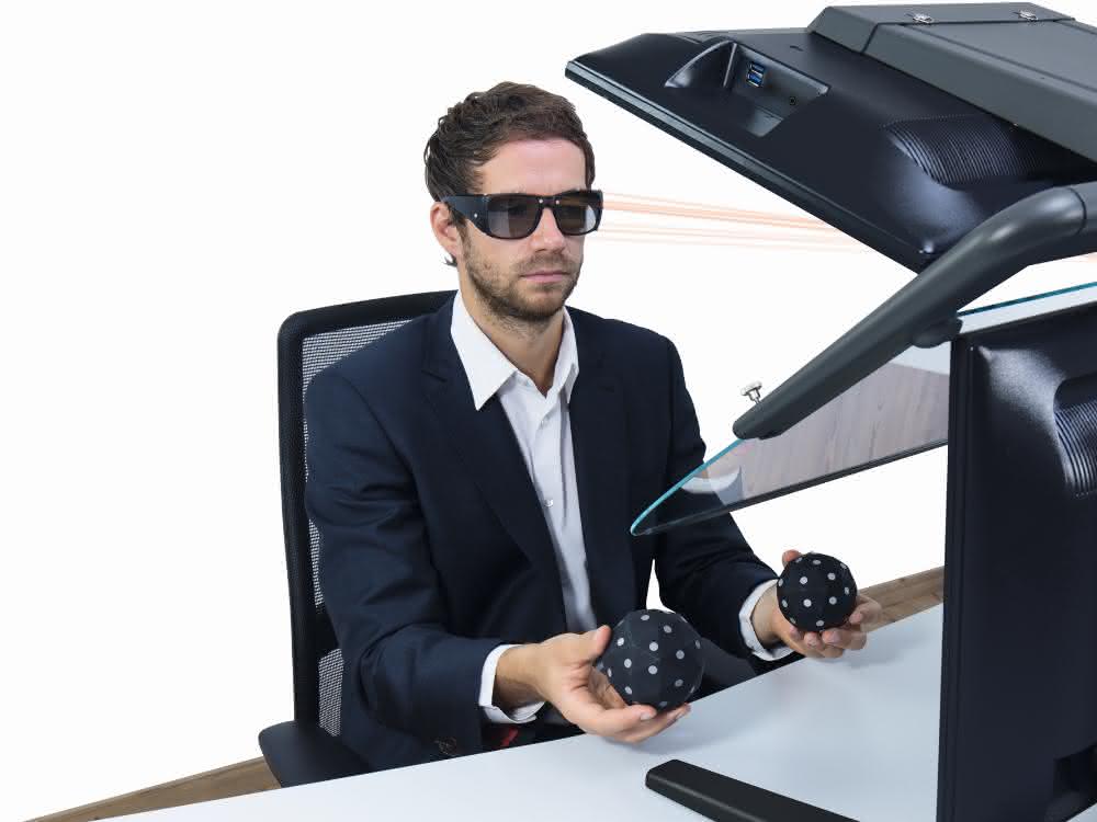 User with VR glasses and tracking balls
