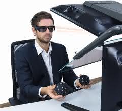 User with VR glasses and tracking balls