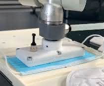 Mini area gripper grips a mask