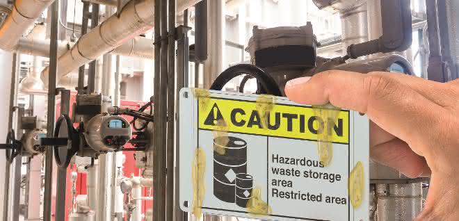 Stainless steel sign with Caution lettering