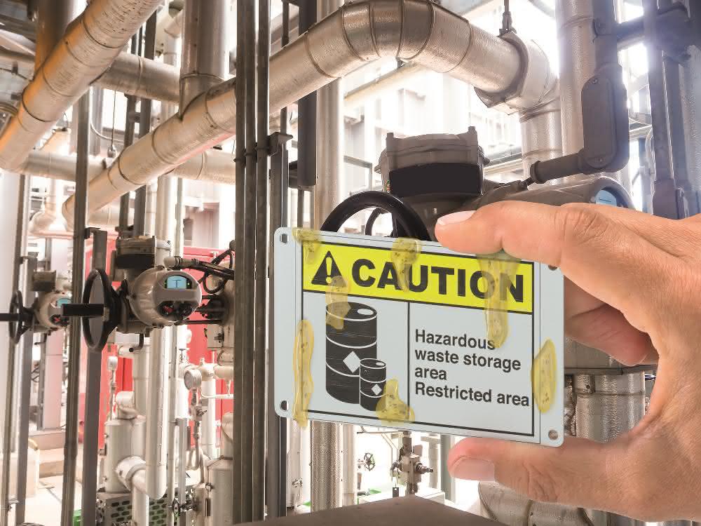 Stainless steel sign with Caution lettering