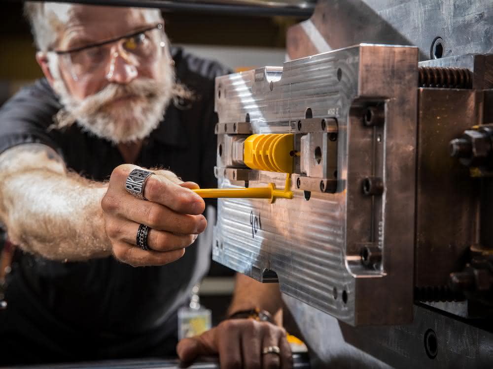 Injection molding worker