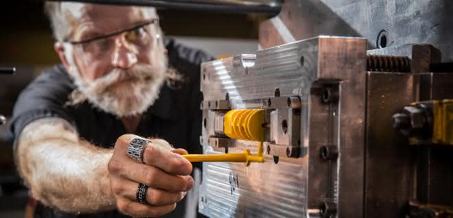 Injection molding worker