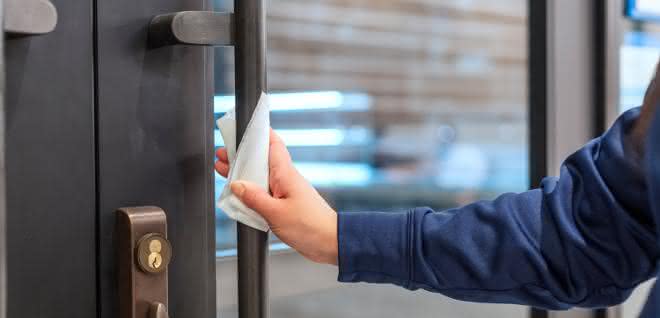 Hygiene protocols in many areas Cleaning a door handle