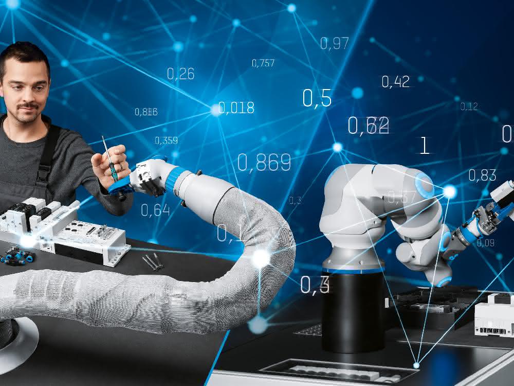 Researchers with robotic arms