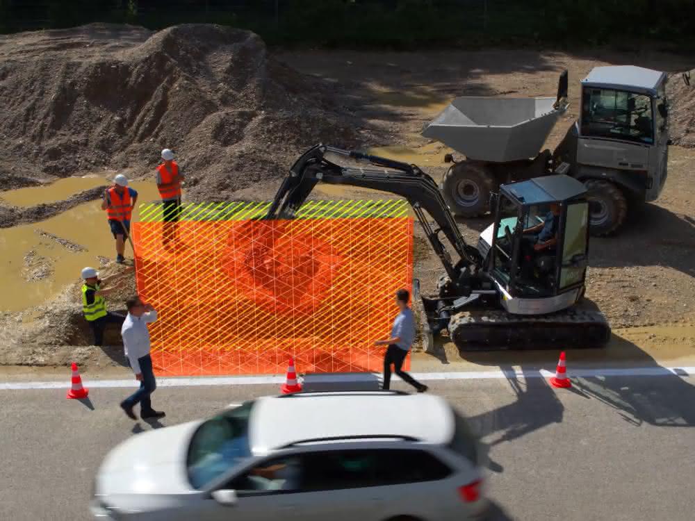 Bagger am Straßenrand mit markiertem Aktionsradius