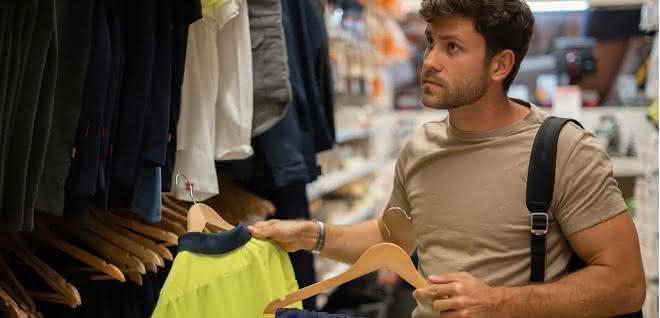 Man chooses his work clothes.